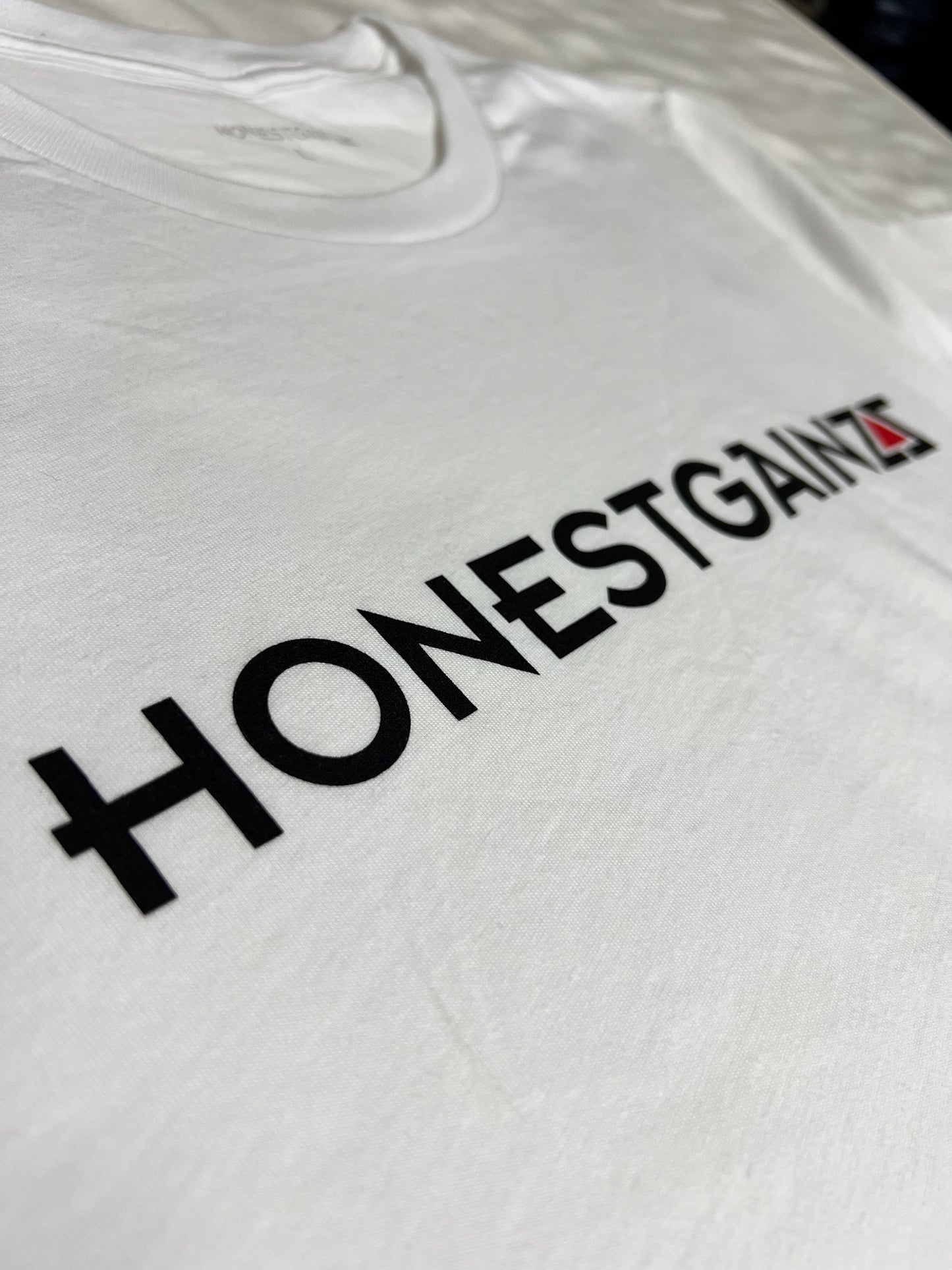 Honestgainzz™ White Deluxe Tee